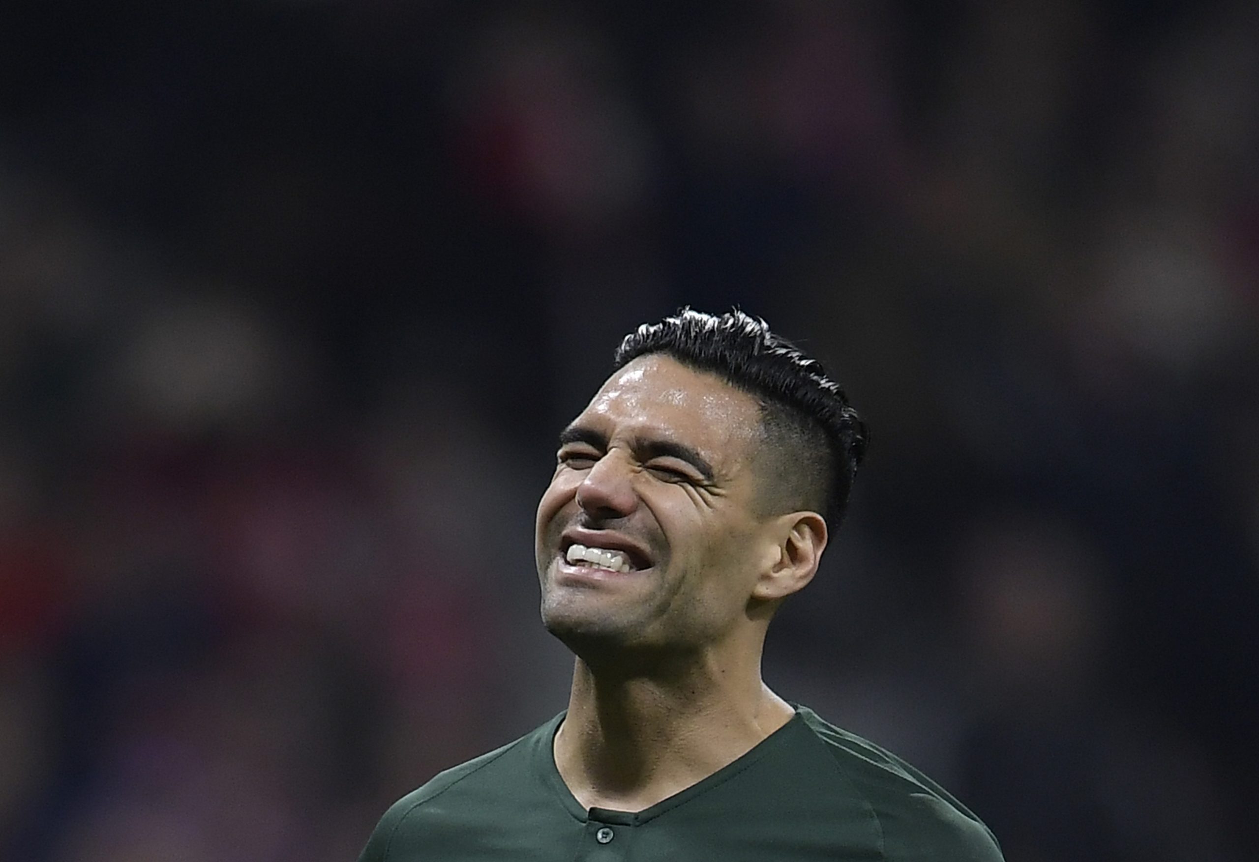 Monaco's Colombian forward Radamel Falcao reacts after missing a penalty kick during the UEFA Champions League group A football match between Atletico Madrid and Monaco at the Wanda Metropolitan stadium in Madrid on November 28, 2018. (Photo by OSCAR DEL POZO / AFP)