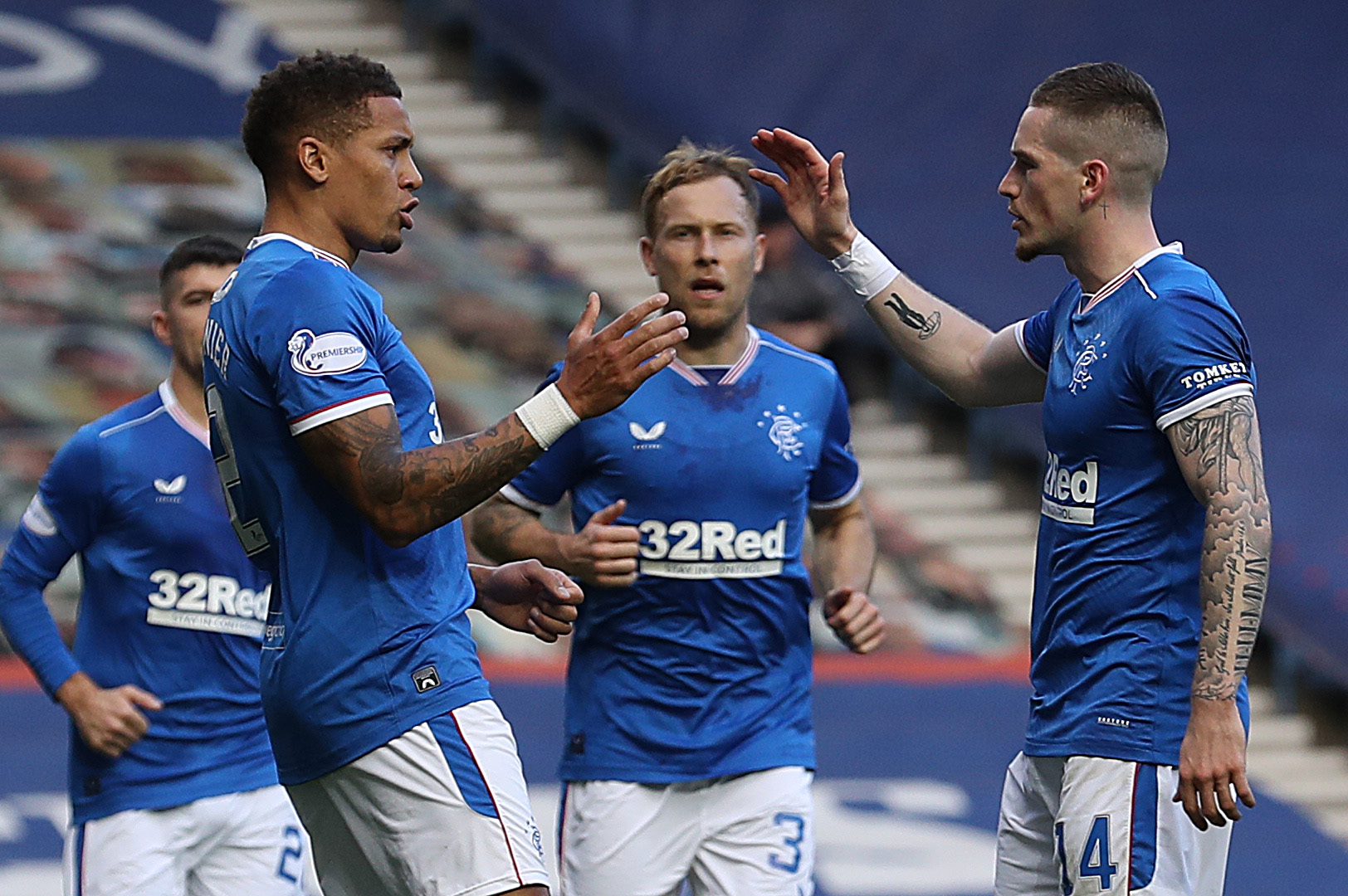 GLASGOW, SCOTLAND - OCTOBER 04: James Tavernier of Rangers celebrates scoring the opening goal with Ryan Kent during the Ladbrokes Scottish Premiership match between Rangers and Ross County at Ibrox Stadium on October 04, 2020 in Glasgow, Scotland. Sporting stadiums around the UK remain under strict restrictions due to the Coronavirus Pandemic as Government social distancing laws prohibit fans inside venues resulting in games being played behind closed doors.