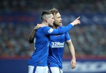 GLASGOW, SCOTLAND - NOVEMBER 08: Scott Arfield of Rangers celebrates with teammate Ryan Kent after scoring his team's first goal during the Ladbrokes Scottish Premiership match between Rangers and Hamilton Academical at Ibrox Stadium on November 08, 2020 in Glasgow, Scotland. Sporting stadiums around the UK remain under strict restrictions due to the Coronavirus Pandemic as Government social distancing laws prohibit fans inside venues resulting in games being played behind closed doors.