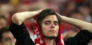 MADRID, SPAIN - MAY 22: A Bayern Muenchen fan looks dejected after their team's defeat at the end of the UEFA Champions League Final match between FC Bayern Muenchen and Inter Milan at the Estadio Santiago Bernabeu on May 22, 2010 in Madrid, Spain.