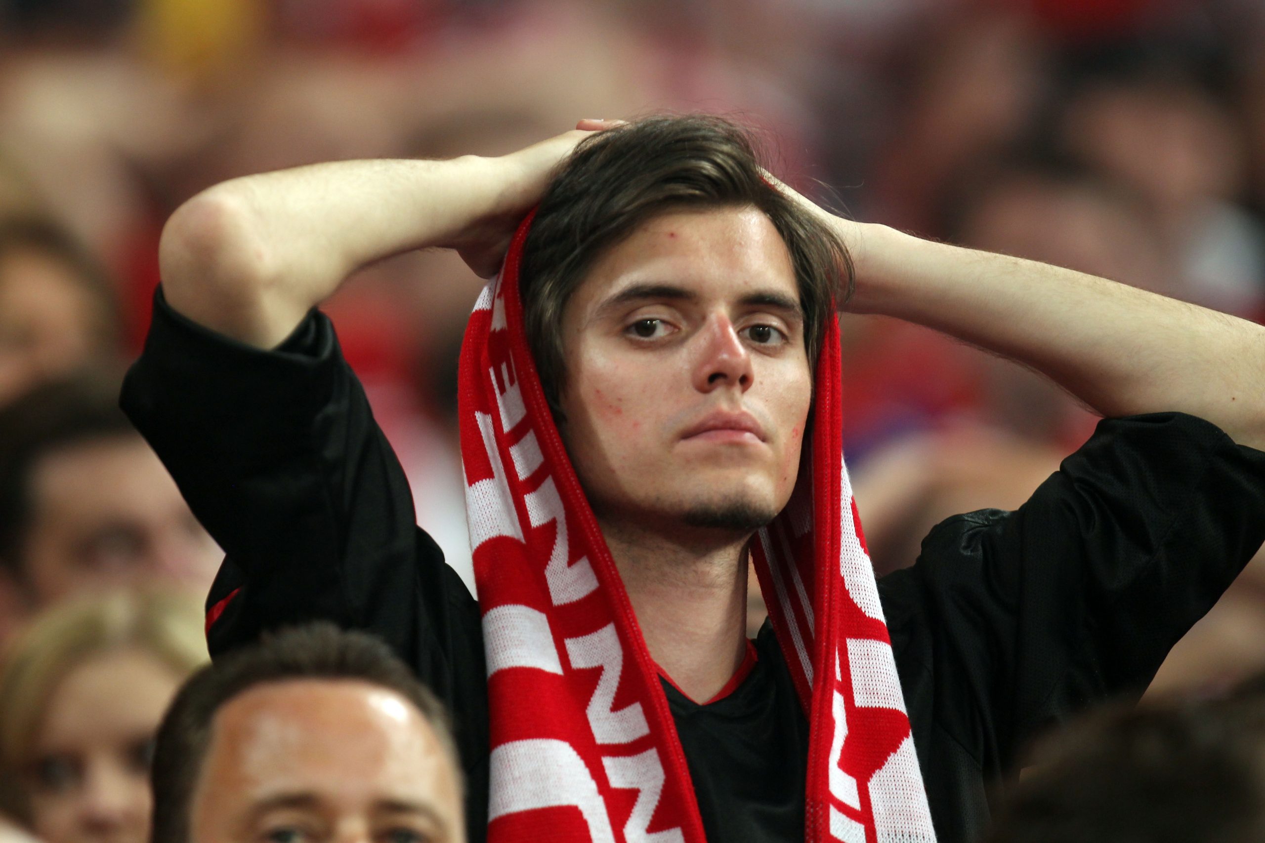 MADRID, SPAIN - MAY 22: A Bayern Muenchen fan looks dejected after their team's defeat at the end of the UEFA Champions League Final match between FC Bayern Muenchen and Inter Milan at the Estadio Santiago Bernabeu on May 22, 2010 in Madrid, Spain.