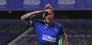 GLASGOW, SCOTLAND - OCTOBER 01: Scott Arfield of Rangers celebrates after scoring his team's first goal during the UEFA Europa League play-off match between Rangers and Galatasaray at Ibrox Stadium on October 01, 2020 in Glasgow, Scotland. Football Stadiums around Europe remain empty due to the Coronavirus Pandemic as Government social distancing laws prohibit fans inside venues resulting in fixtures being played behind closed doors.