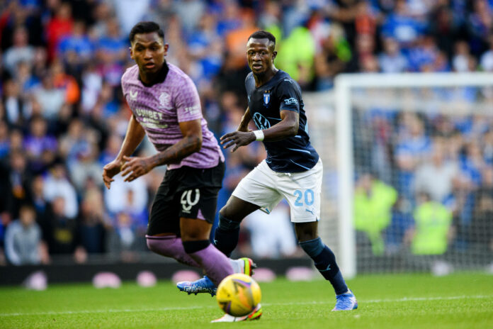 210810 Alfredo Morelos of Rangers and Bonke Innocent of Malmö FF during the UEFA Champions League qualifying match betw