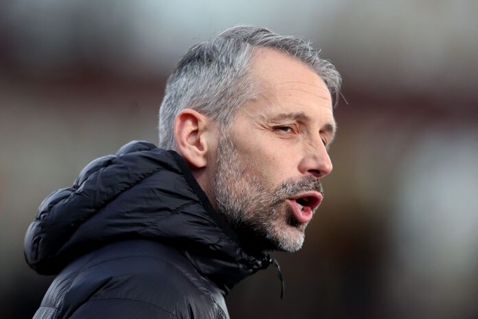 Marco Rose on the touchline during a Bundesliga match, giving instructions to his players.