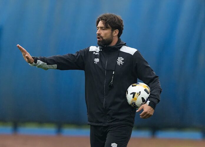 Russell Martin overseeing training at Rangers Training Centre in club gear