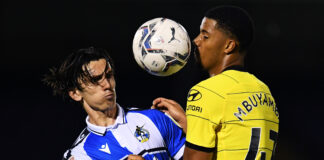 Xavier Mbuyamba (right) challenges for the ball during a match between Chelsea U21s and Bristol Rovers
