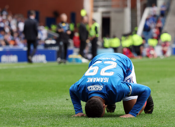 Hamza Igamane in Rangers kit bowing at Ibrox