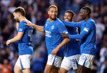 Cyriel Dessers celebrates with team mates at Ibrox in the Premiership.