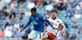 Hamza Igamane controlling the ball in a Rangers kit at Ibrox during transfer speculation.