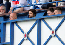 Rangers coaching and analysis team, including manager Russell Martin, watch from the stands during a pre-season friendly against Middlesbrough at Ibrox Stadium.