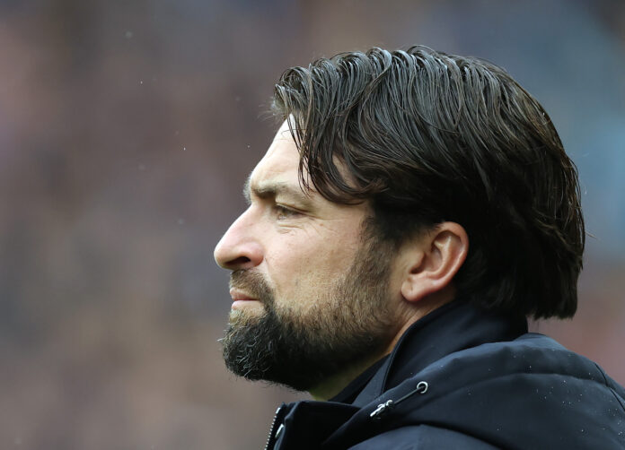 Close-up side profile of Rangers manager Russell Martin watching the match with a serious expression.