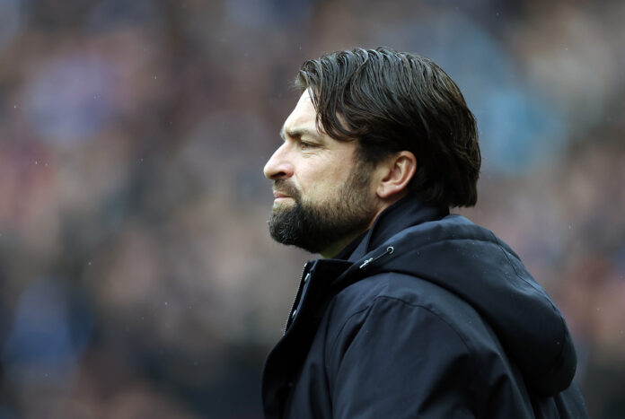 Close-up side profile of Rangers manager Russell Martin watching the match with a serious expression.
