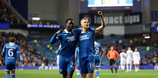 Oliver Antman and Djeidi Gassama celebrate together under the lights at Ibrox.