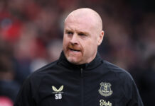Sean Dyche, Everton manager, on the touchline in a Premier League match wearing a black Castore jacket.