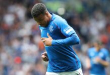 Hamza Igamane in Rangers blue kit running on the pitch during a Premiership match at Ibrox.