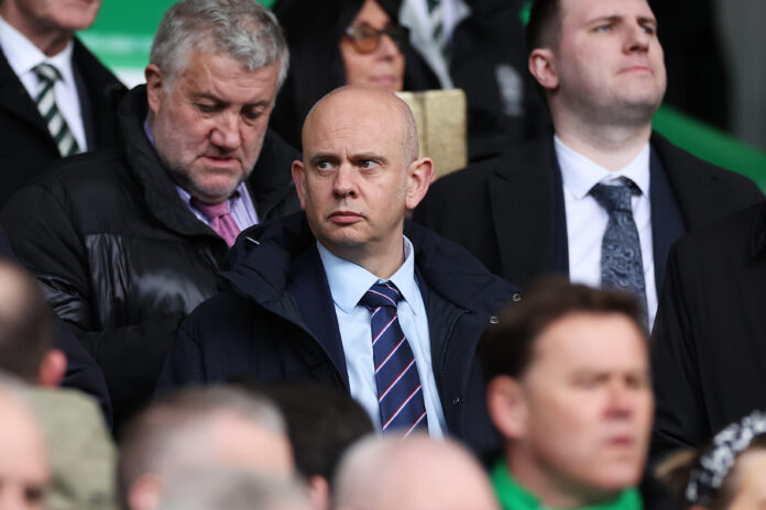 Patrick Stewart watching from the stands during an Old Firm clash, appearing tense among Rangers officials.