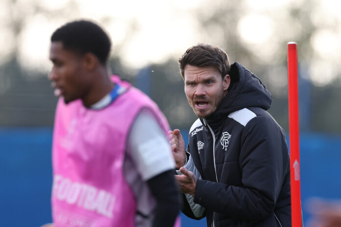 Danny Rohl giving animated tactical instructions during Rangers training session before Europa League match