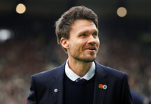 Danny Rohl smiling pitchside before Rangers match in the Premier Sports Cup semi final