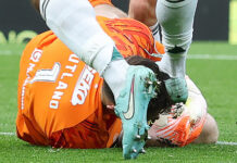 Rangers goalkeeper Jack Butland lies injured on the ground as Austin Trusty;s boot comes down near his head during the Hampden clash.