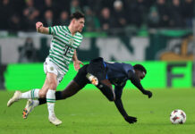 Djeidi Gassama loses possession for Rangers under pressure from Ferencváros during Europa League match in Hungary