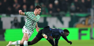 Djeidi Gassama loses possession for Rangers under pressure from Ferencváros during Europa League match in Hungary