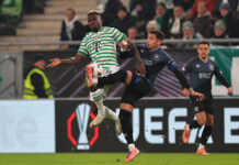 James Tavernier challenges for the ball during Rangers Europa League match against Ferencváros in Hungary