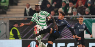 James Tavernier challenges for the ball during Rangers Europa League match against Ferencváros in Hungary