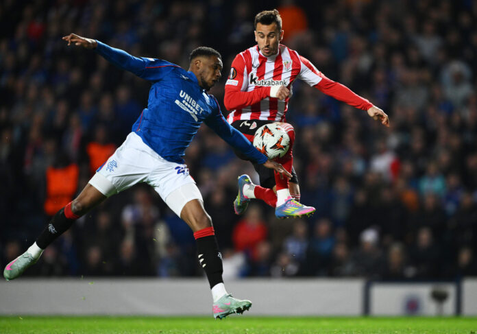 Dujon Sterling challenges an Athletic Club player during Rangers’ Europa League match at Ibrox, highlighting his strength and defensive power.