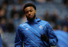 Youssef Chirmiti warming up for Rangers in blue training jacket before a match.