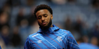 Youssef Chirmiti warming up for Rangers in blue training jacket before a match.