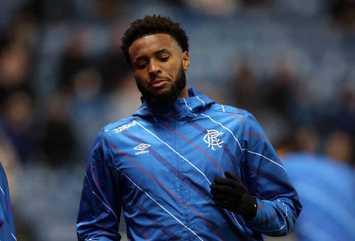 Youssef Chirmiti warming up for Rangers in blue training jacket before a match.