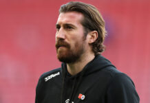 Joe Rothwell of Rangers inspects the pitch