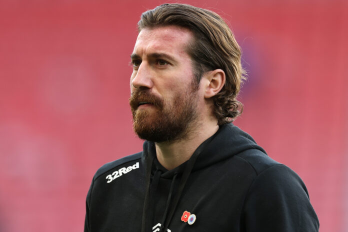 Joe Rothwell of Rangers inspects the pitch