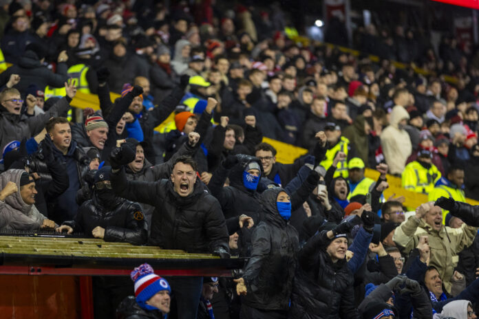 Rangers fans react passionately in the away end at Pittodrie during Aberdeen v Rangers Scottish Premiership match