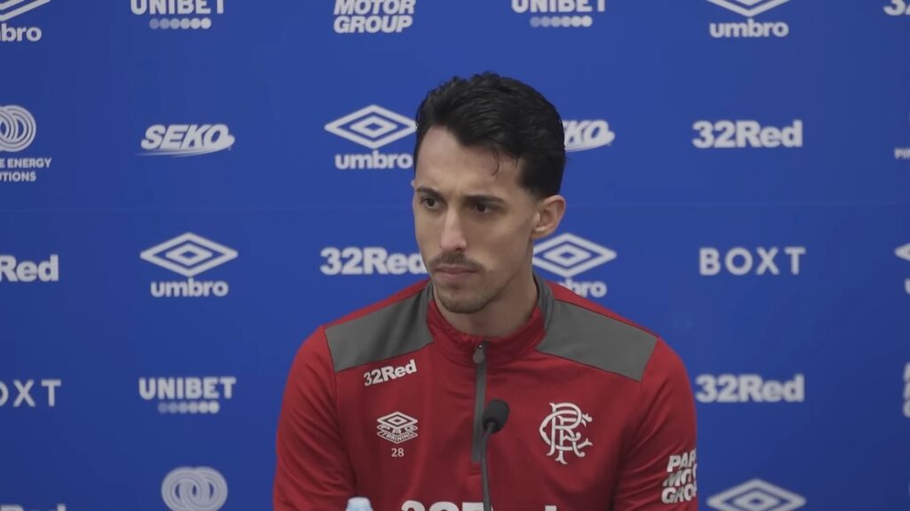 Bojan Miovski speaking at a Rangers press conference in training kit