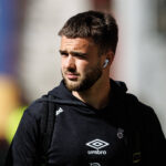 Rangers midfielder Nicolas Raskin arrives at an away match.
