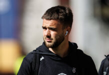 Rangers midfielder Nicolas Raskin arrives at an away match.