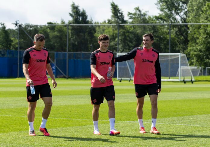 Lawrence Shankland, Findlay Curtis and John Souttar arrive at training.