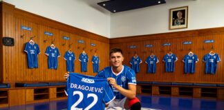 New Rangers midfielder Vanja Dragojevic with the Rangers shirt.