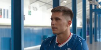 New Rangers signing Vanja Dragojevic poses in the shirt at Ibrox.