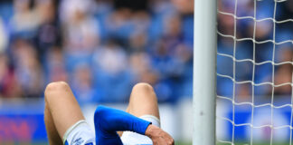 Ryan Naderi struggles with injury at Ibrox for Rangers.